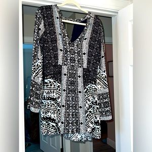 Free people bell sleeve, 3/4 sleeve length with key whole back. Never worn